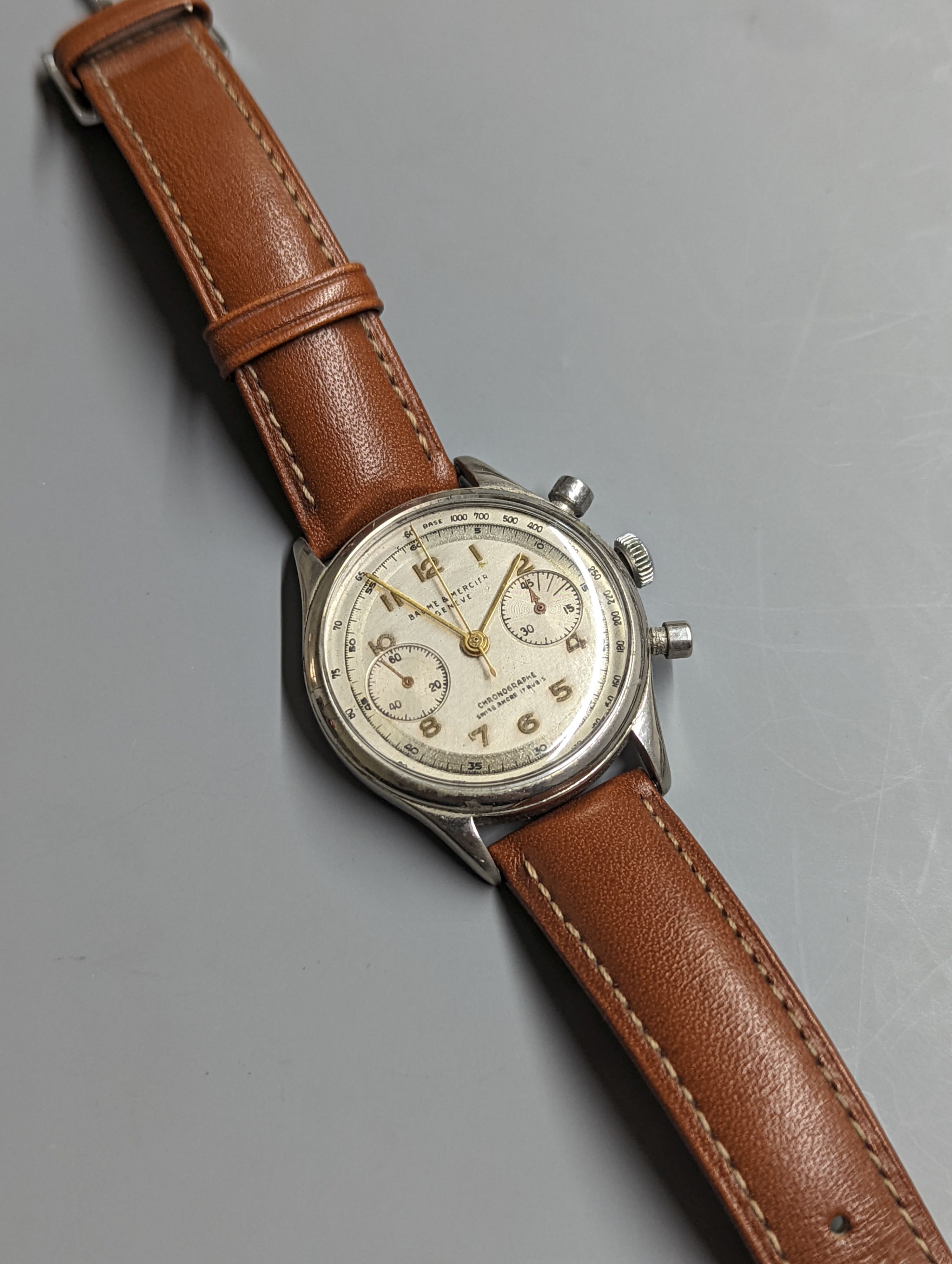 A gentleman's stainless steel Baume & Mercier Chronographe wrist watch, with Arabic numerals and two subsidiary dials, case diameter 35mm, on a later associated leather strap.